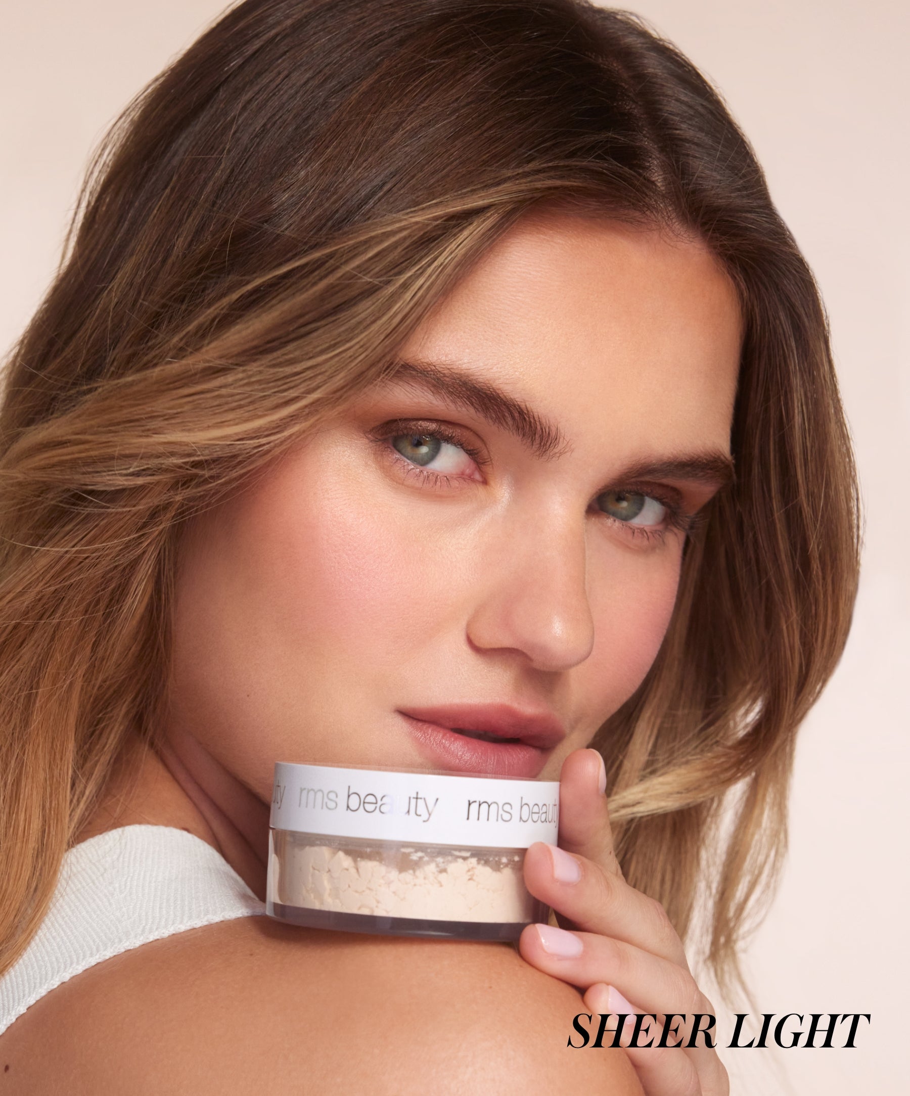 Close-up of model wearing RMS Hydra Setting Powder in shade Light