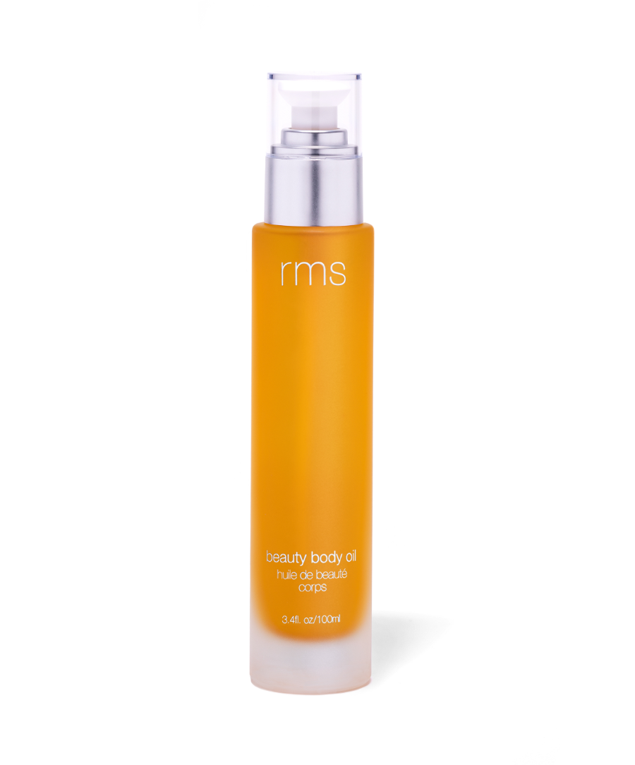 Glass bottle of RMS Beauty Body Oil with a pump dispenser, showing a lightweight, golden-hued oil designed to hydrate and nourish the skin